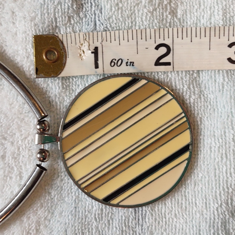 Necklace, round medallion with yellow, tan and black, New York and Company